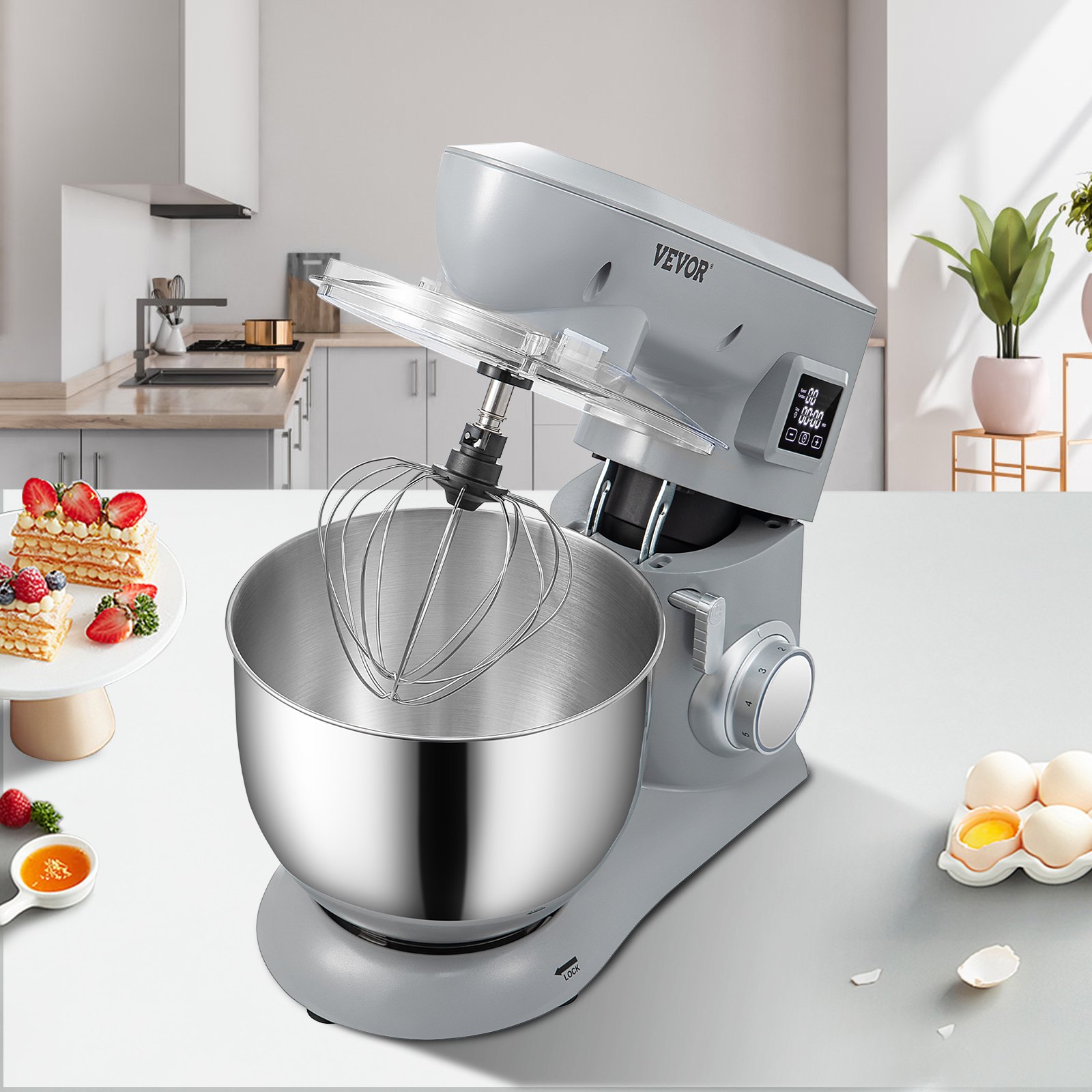 Batidora de pie VEVOR en una cocina moderna con recipiente de acero inoxidable, accesorio para batir e ingredientes cercanos.
