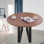 Mesa redonda de madera con patas de acero VEVOR, dos tazas de té y una revista en una habitación minimalista.