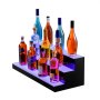 Estante de barra LED VEVOR de tres niveles que muestra varias botellas de licor sobre una superficie azul brillante.