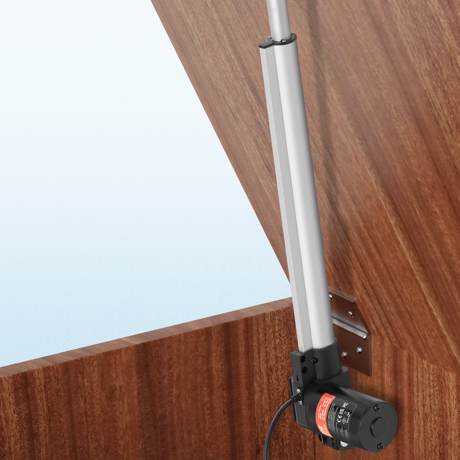 Actuador lineal VEVOR 12v montado sobre superficie de madera con cableado visible y mecanismo de bisagra.