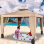 Tienda de campaña para exteriores VEVOR en una playa soleada, dos personas disfrutando de un picnic en el interior.