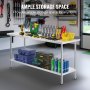 VEVOR stainless steel work table in a well-organized garage holding various tools and storage bins.