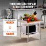 VEVOR stainless steel work table with vegetables and utensils on top, microwave on bottom shelf.