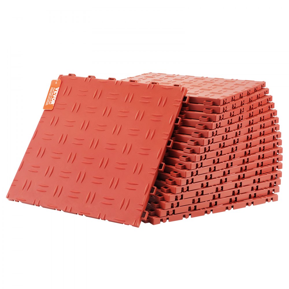 red interlocking VEVOR garage tiles stacked in a pile, showing a diamond plate pattern.