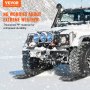 VEVOR-tractieplaten onder een besneeuwd terreinvoertuig, voor duurzaamheid bij extreme weersomstandigheden.