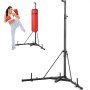 woman practicing kicks with a VEVOR punching bag stand and red punching bag.