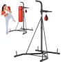 woman kicking VEVOR punching bag stand with red punching bags, emphasizing training and exercise.