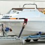 boat secured on a trailer with VEVOR ratchet tie down straps.