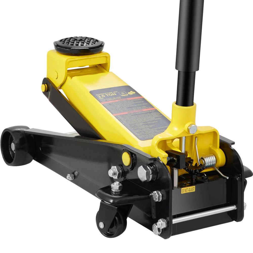 yellow VEVOR 3 ton floor jack with black wheels and handle, focusing on hydraulic lifting mechanism.