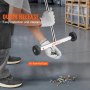 man using VEVOR magnetic sweeper with quick release feature to collect screws in a warehouse.