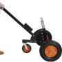 VEVOR trailer dolly with black frame, orange wheels, and a sturdy handle in a user’s hand.