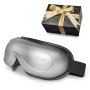 VEVOR heated eye massager with a gift box wrapped in gold ribbon.