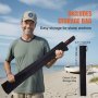 man holds VEVOR sand spike anchor in black storage bag on a beach, next to a boat. includes storage bag.