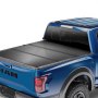 blue ram truck with VEVOR tri-fold truck bed cover installed, showcasing a sleek and secure fit.