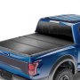 VEVOR tri-fold truck bed cover on blue pickup truck, sleek and durable protection for cargo.