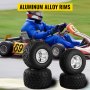 VEVOR go kart tires on aluminum alloy rims with racer on track in background.