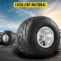 VEVOR go kart tires and rims on asphalt, with a blue sky and mountains in the background.