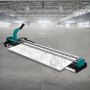 VEVOR tile cutter in an expansive warehouse setting.