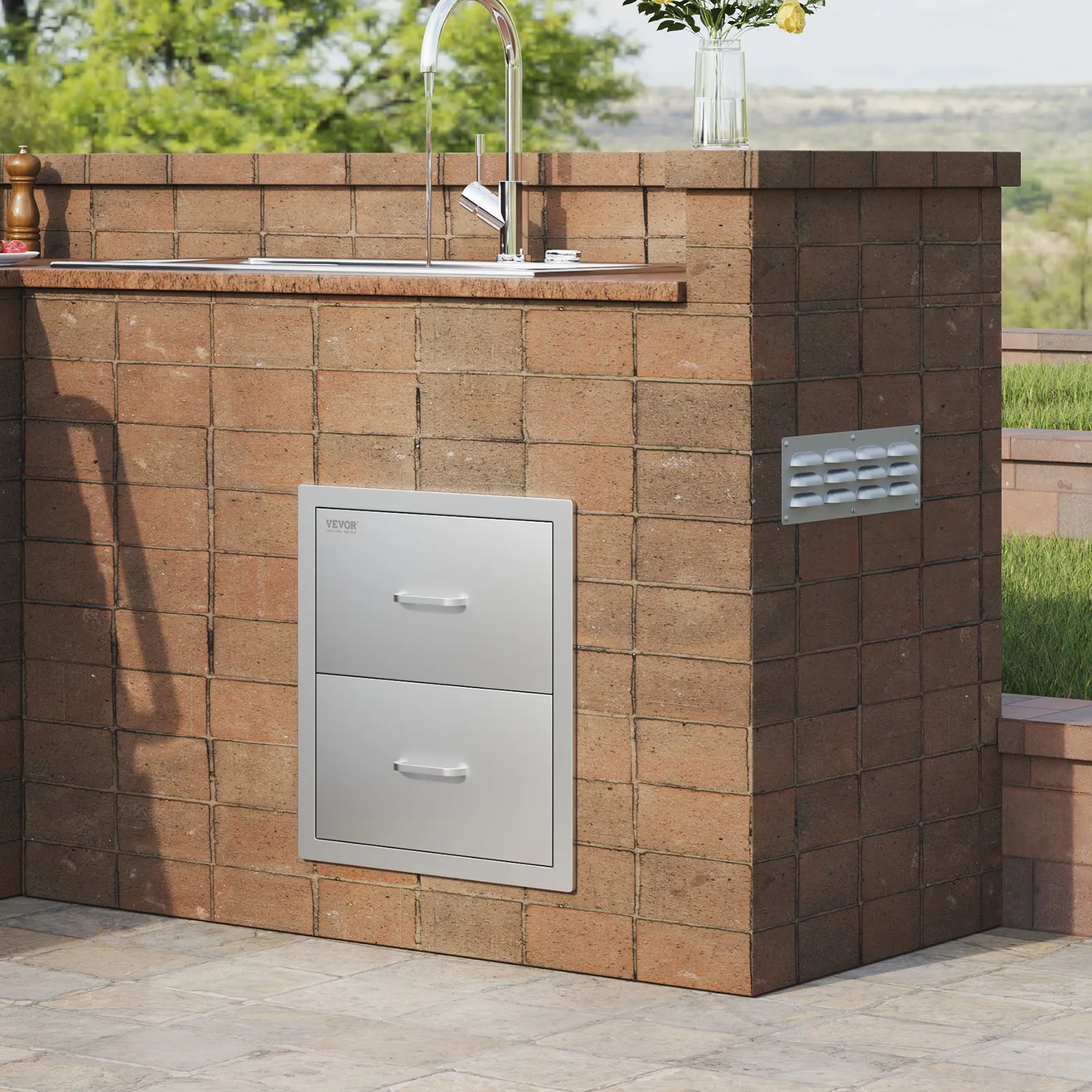brick outdoor kitchen with stainless steel VEVOR outdoor kitchen drawers and sink.