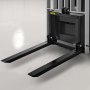 VEVOR 3 point hitch pallet fork on a smooth floor, ready for heavy lifting.