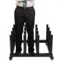 man standing on a sturdy VEVOR vinyl roll rack with caster wheels, showcasing durability.