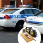 police cars with VEVOR car warning alarm system components on a sunny street.