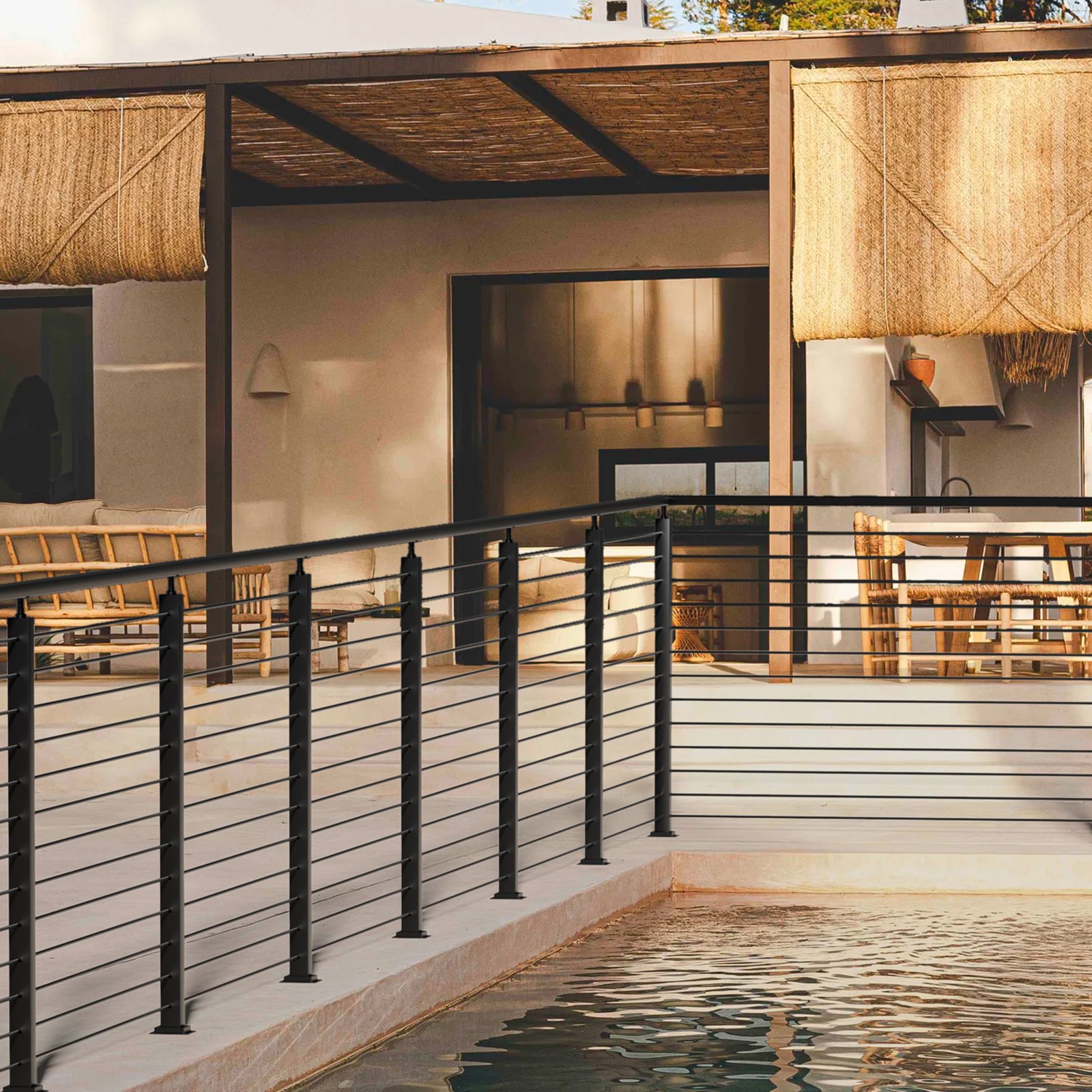 modern poolside patio with VEVOR cable railing post, bamboo roof, and wicker furniture in a cozy setting.