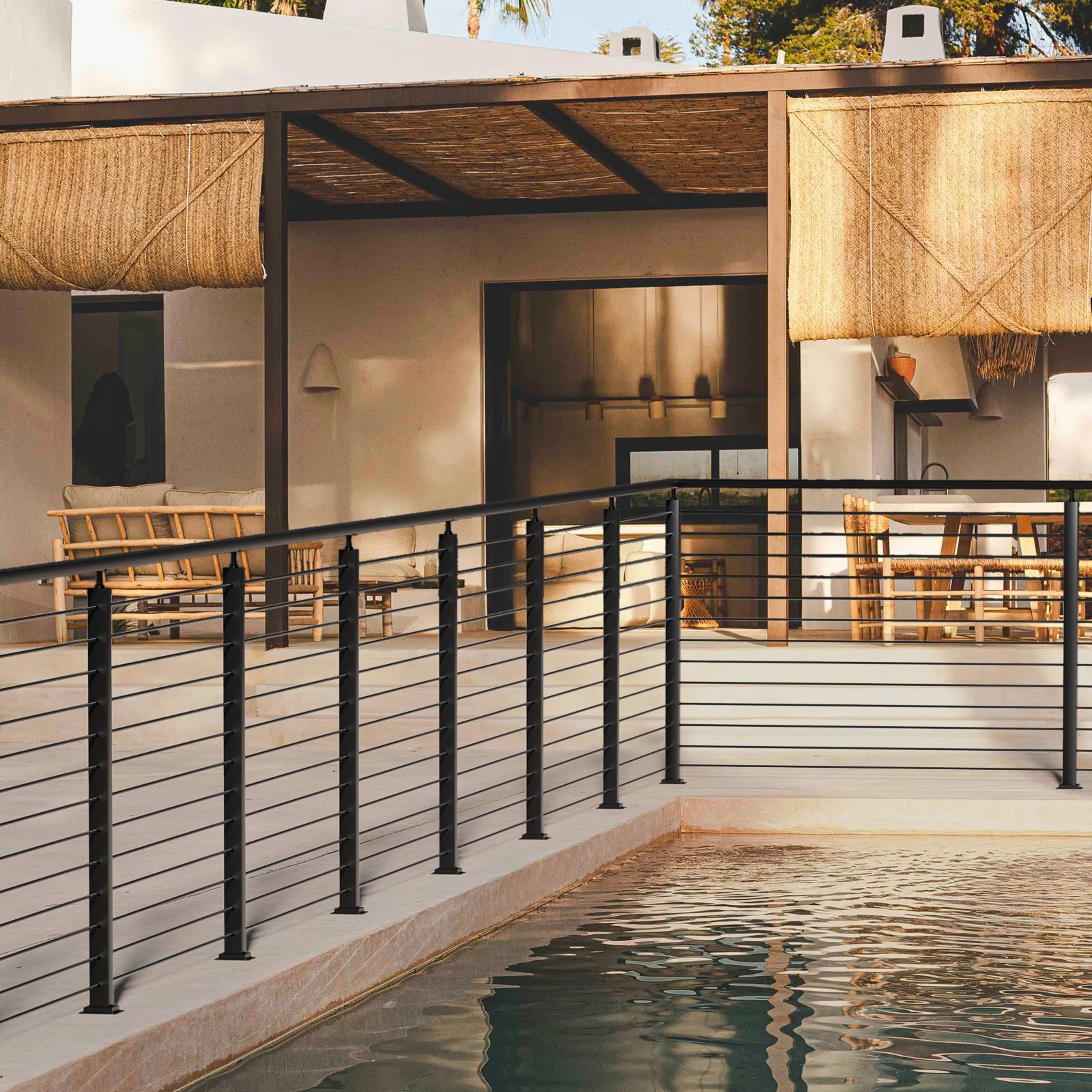 modern patio with pool and VEVOR cable railing post, featuring outdoor seating and bamboo accents.