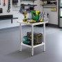 VEVOR stainless steel work table in a garage with tools and storage boxes.