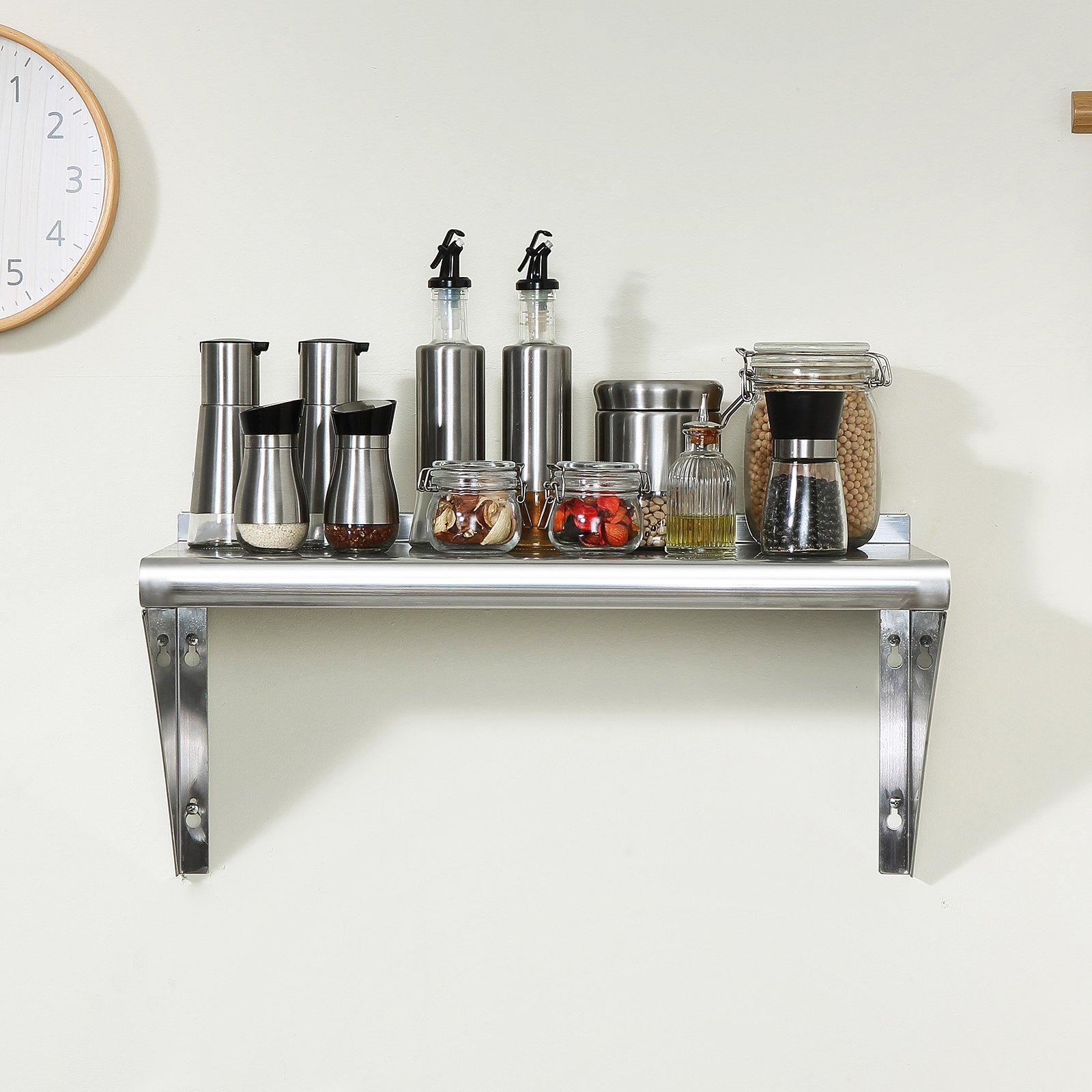 VEVOR stainless steel shelf in kitchen with spice jars and containers, under a clock.