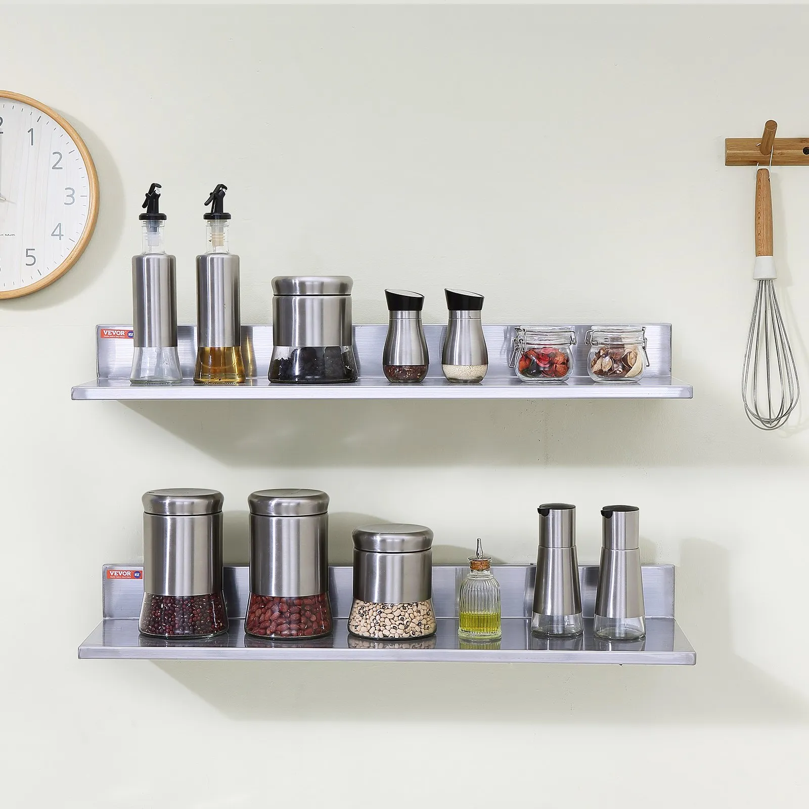 wall-mounted VEVOR stainless steel shelf with jars and containers, kitchen clock, and whisk hanging.