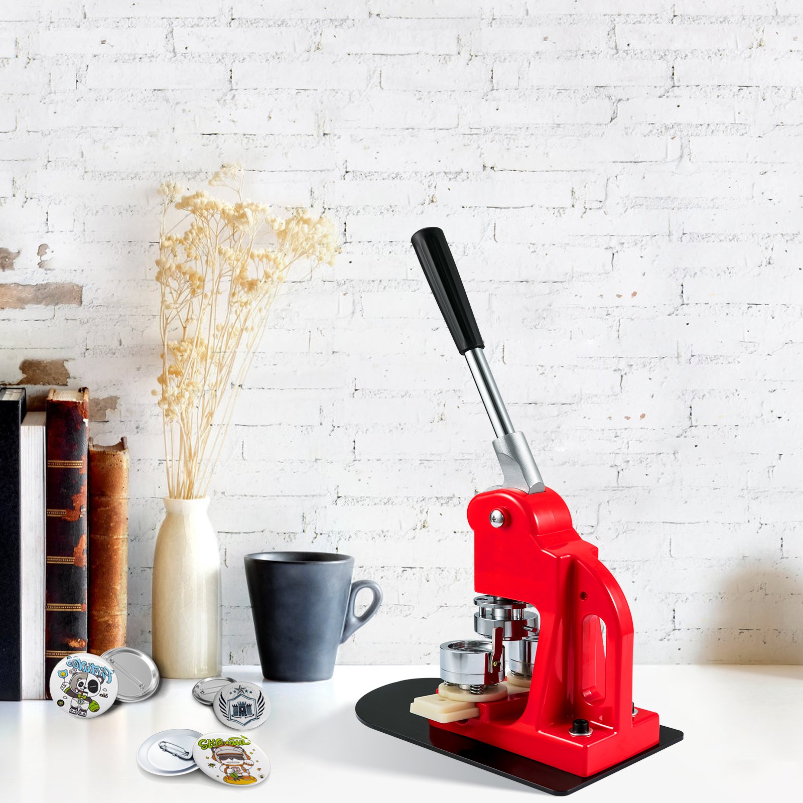 VEVOR button maker machine on a white desk with vintage books, a vase, a mug, and custom buttons.