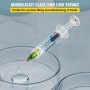 transparent VEVOR glass syringe, precisely dispensing fluid into a petri dish, ideal for lab use.