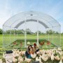VEVOR large metal chicken coop in a field with chickens and two people tending to white hens outside.