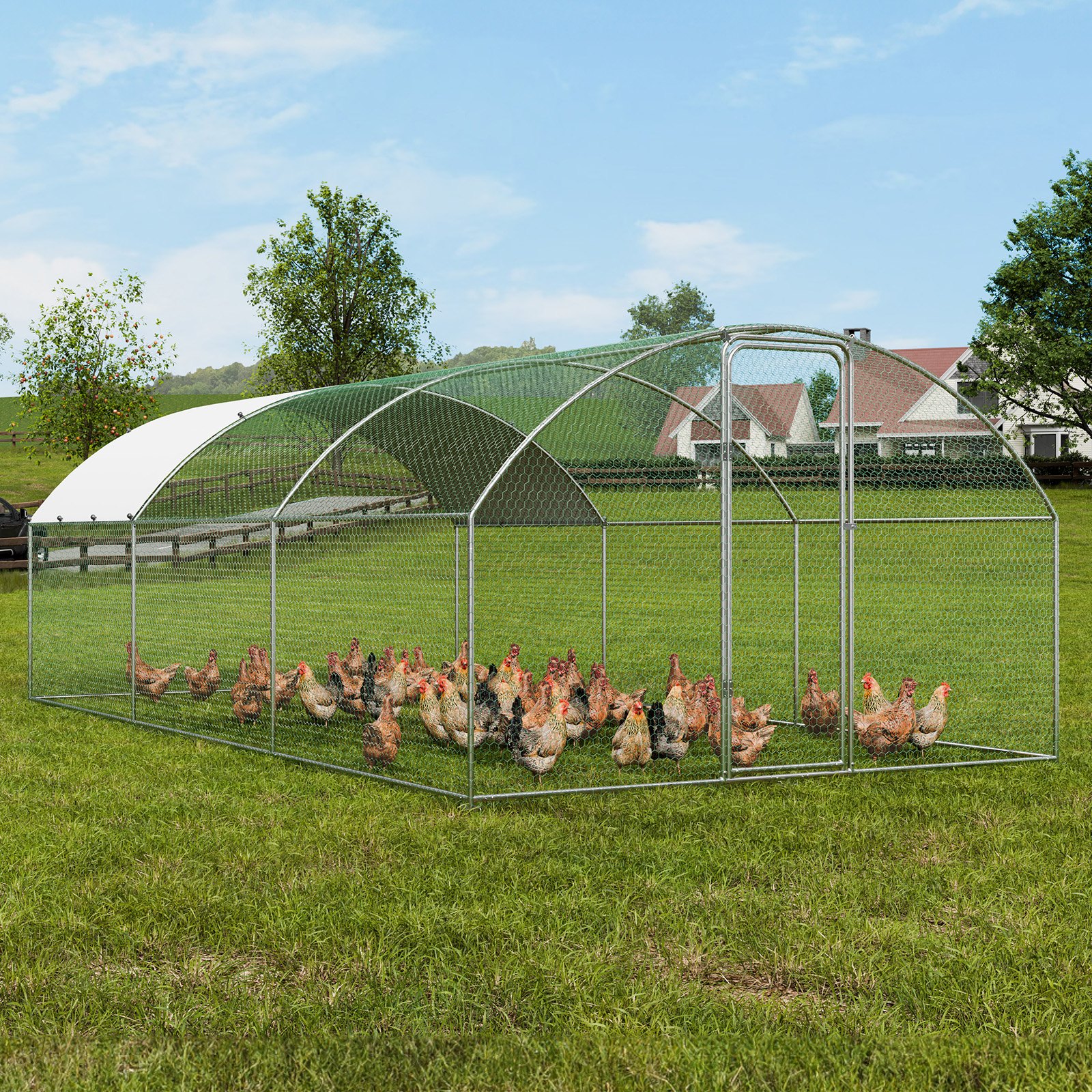 VEVOR chicken coop housing multiple chickens in a large green field with a farmhouse in the background.