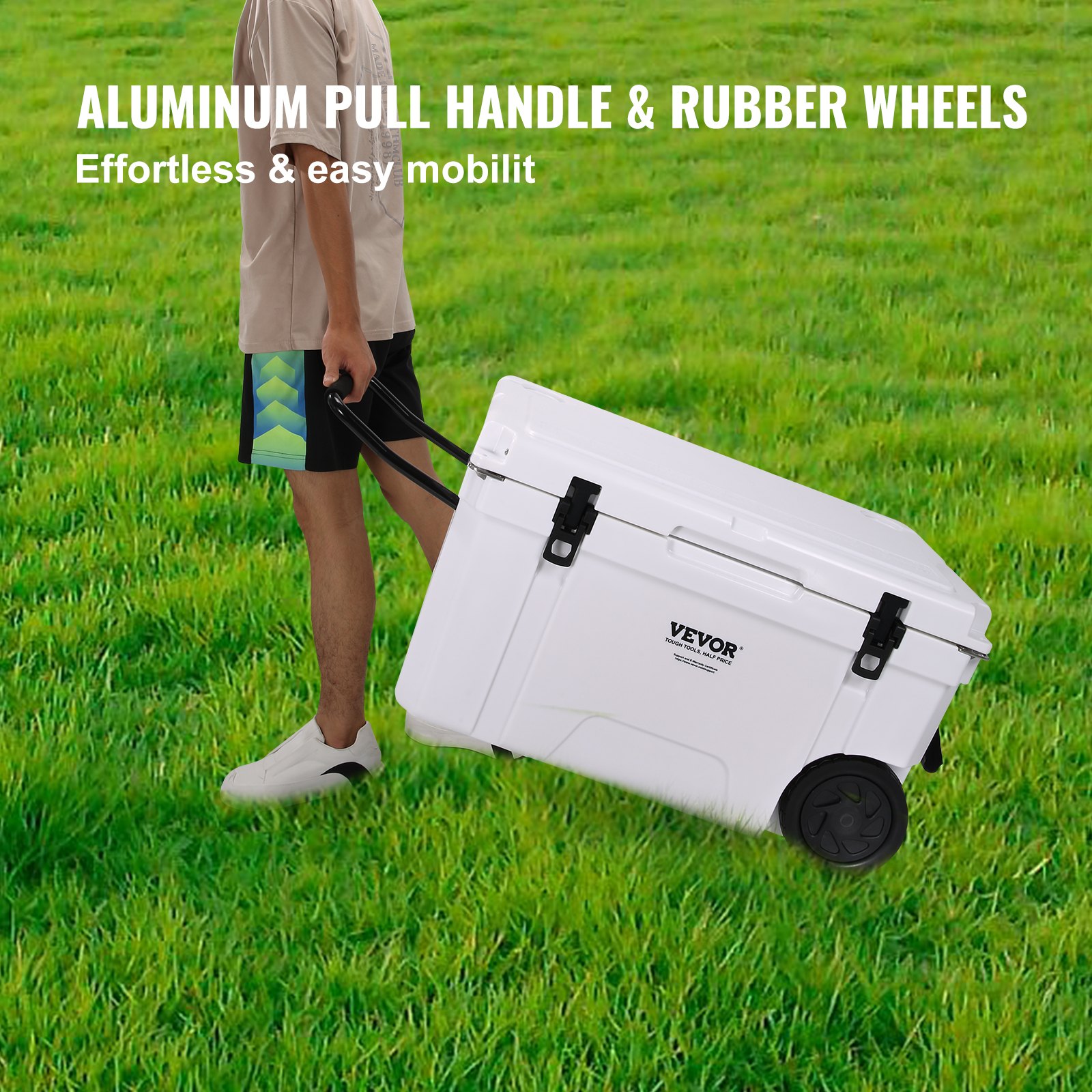 person pulling a VEVOR insulated portable cooler with aluminum handle and rubber wheels on grass.
