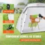 VEVOR portable paint booth used for painting a chair, featuring wind-proof hooks, fiberglass poles, and stakes.