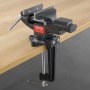 VEVOR bench vise clamped to a wooden workbench, showcasing its grip and sturdy construction.