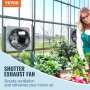 VEVOR shutter exhaust fan in a greenhouse enhancing ventilation with lush green plants.