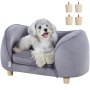 small dog sitting on a gray VEVOR pet sofa with removable wooden legs, looking happy and relaxed.