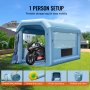 VEVOR inflatable paint booth set up in a backyard with a motorcycle inside, showing easy steps to assemble.