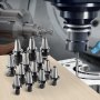 VEVOR cat40 collet holders on a wooden table with cnc milling machine in the background.