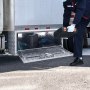 person handling tools from a VEVOR underbody truck box with mounted storage on the side of a truck.