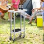 VEVOR stainless steel work table at outdoor gathering, holding two wine bottles and grilled food.