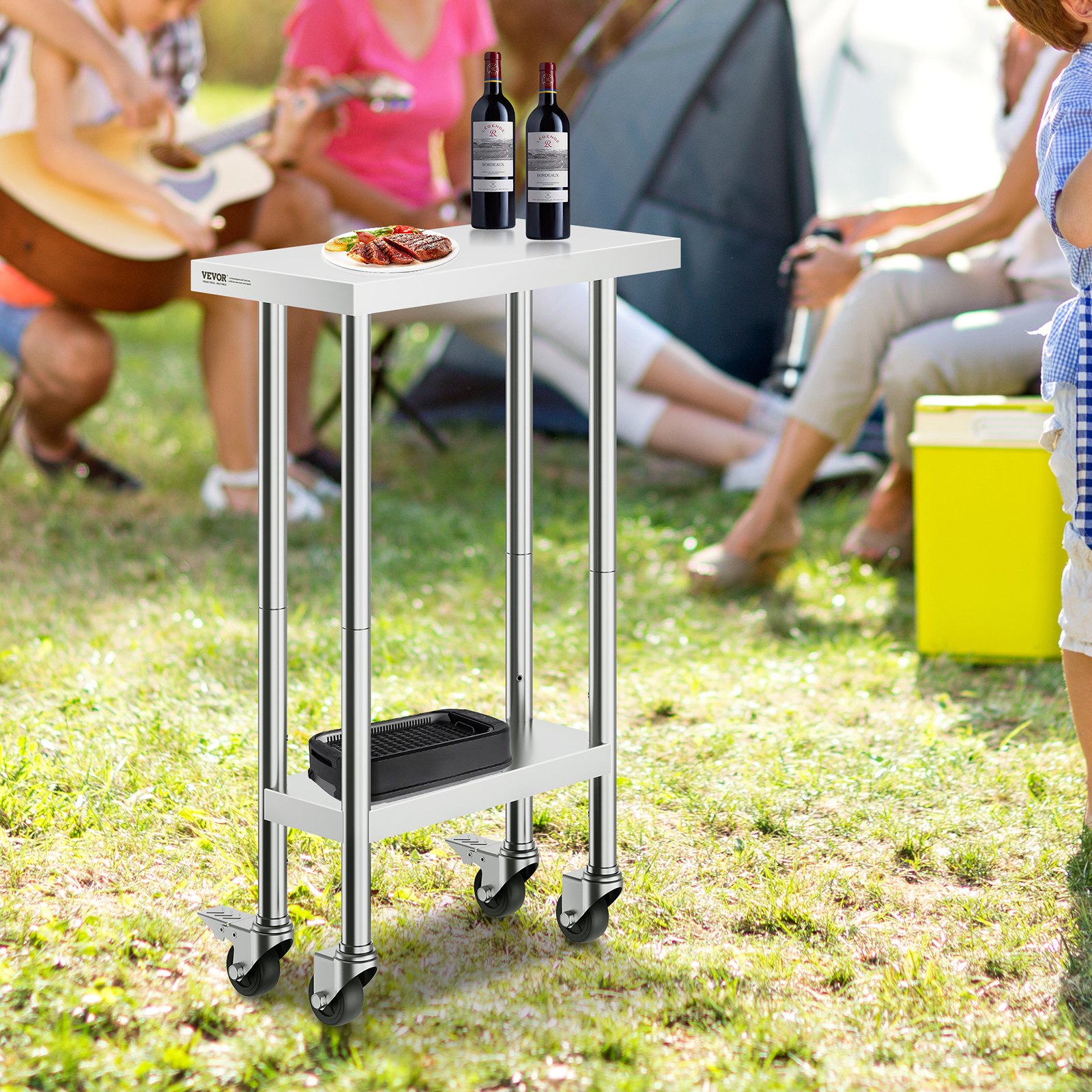 VEVOR stainless steel work table at outdoor gathering, holding two wine bottles and grilled food.