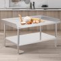 VEVOR stainless steel work table in a kitchen with baking tools and ingredients on top.