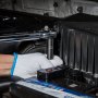 mechanic using a VEVOR impact socket set to work on an engine compartment.