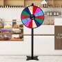 VEVOR spinning prize wheel in a café setting with bakery items and jars on shelves in the background.