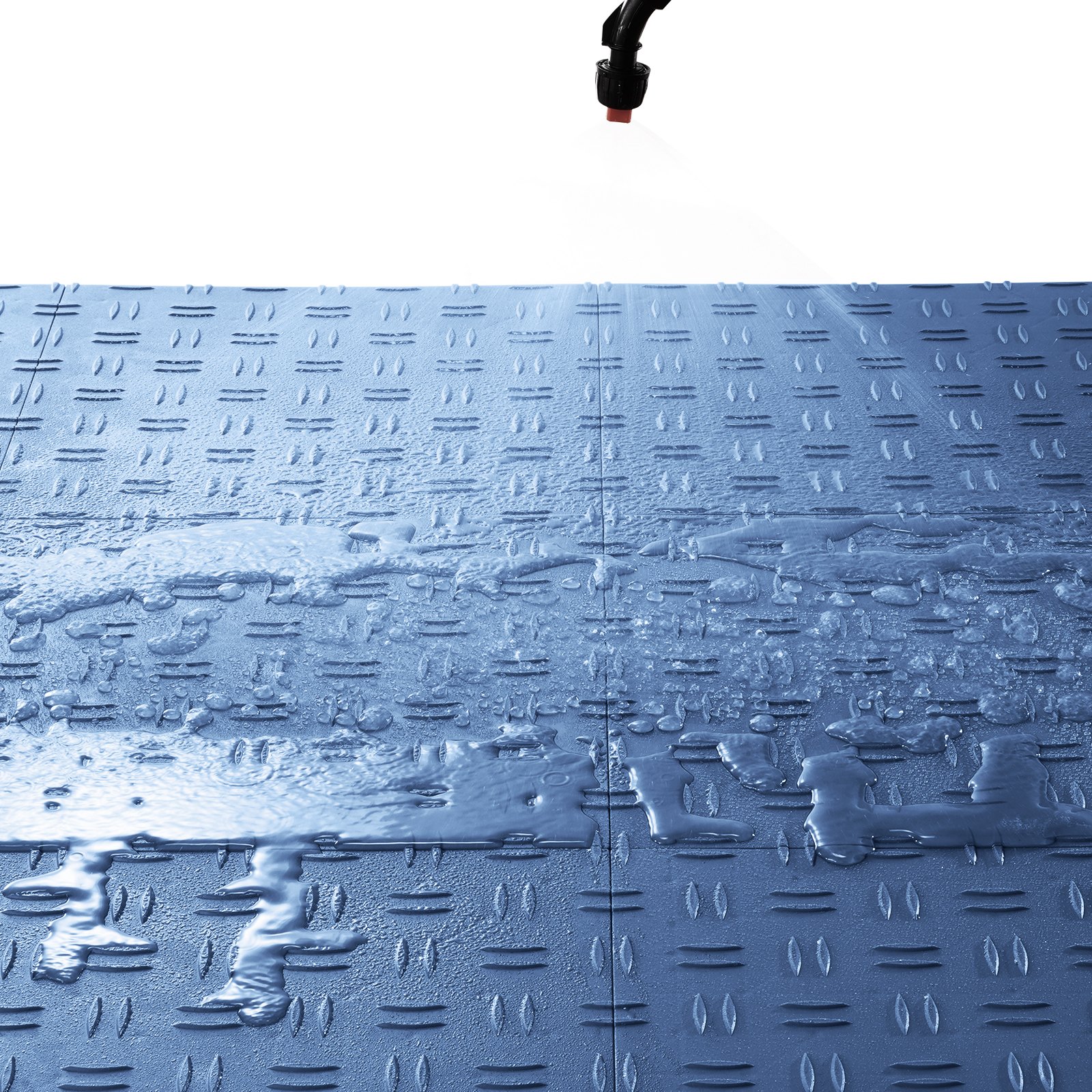 water spray cleaning VEVOR garage tiles with anti-slip surface, showing durability and water resistance.