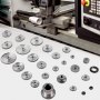 VEVOR mini lathe gears with various sizes displayed near a cnc machine.